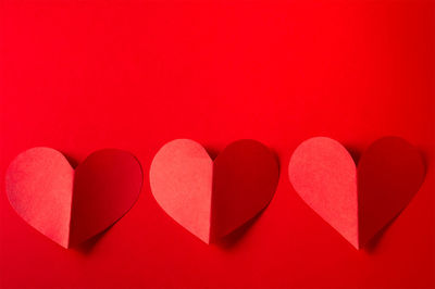 Directly above shot of heart shapes against yellow background