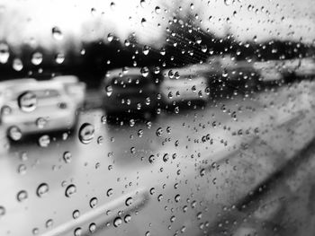 Full frame shot of wet glass window in rainy season