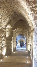 People in corridor of historic building