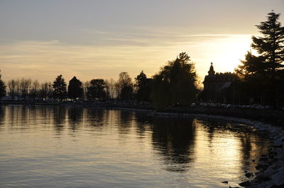 Scenic view of lake against sky during sunset