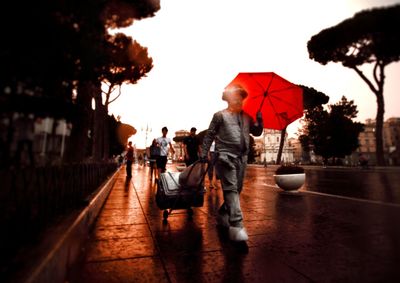 People walking on wet road in rain