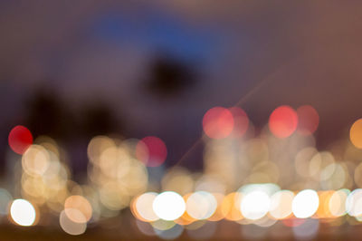 Defocused image of illuminated lights at night