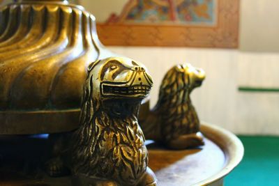 Close-up of horse statue on table at home