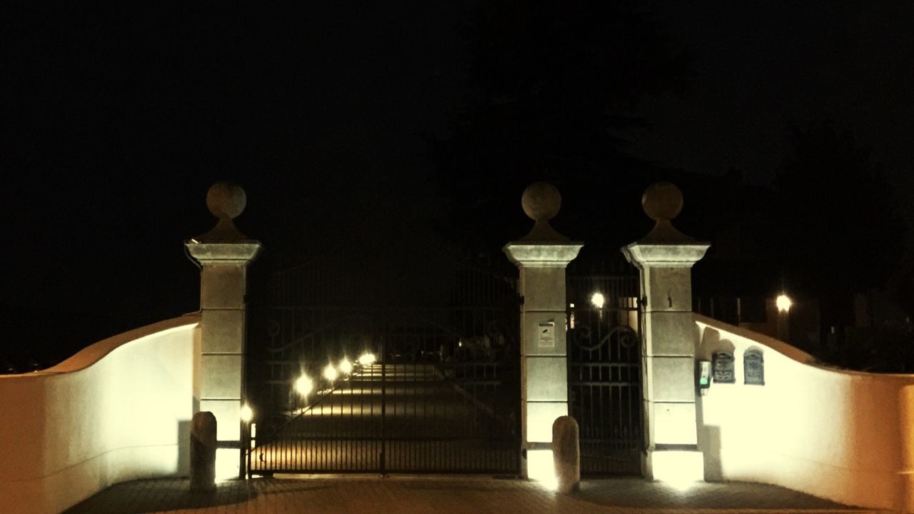 illuminated, night, built structure, lighting equipment, architecture, in a row, architectural column, street light, light - natural phenomenon, building exterior, the way forward, column, indoors, electric lamp, lit, arch, no people, electric light, copy space, dark