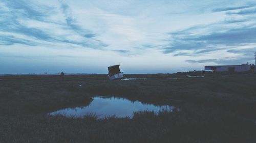 Scenic view of sea against cloudy sky