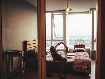 Man relaxing on bed at home