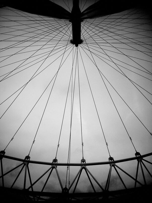 low angle view, built structure, modern, architecture, pattern, indoors, metal, no people, diminishing perspective, ceiling, silhouette, repetition, sky, day, part of, connection, design, directly below, city