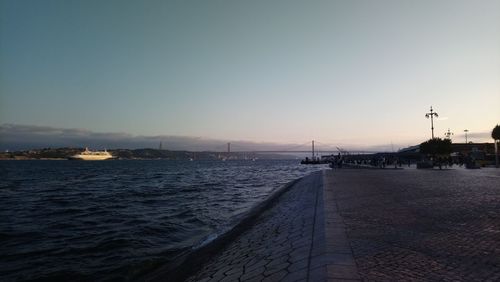 Scenic view of sea against clear sky during sunset