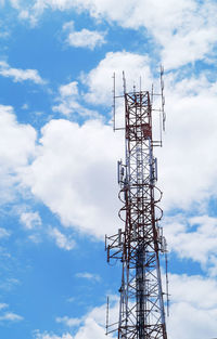 Low angle view of communications tower against sky