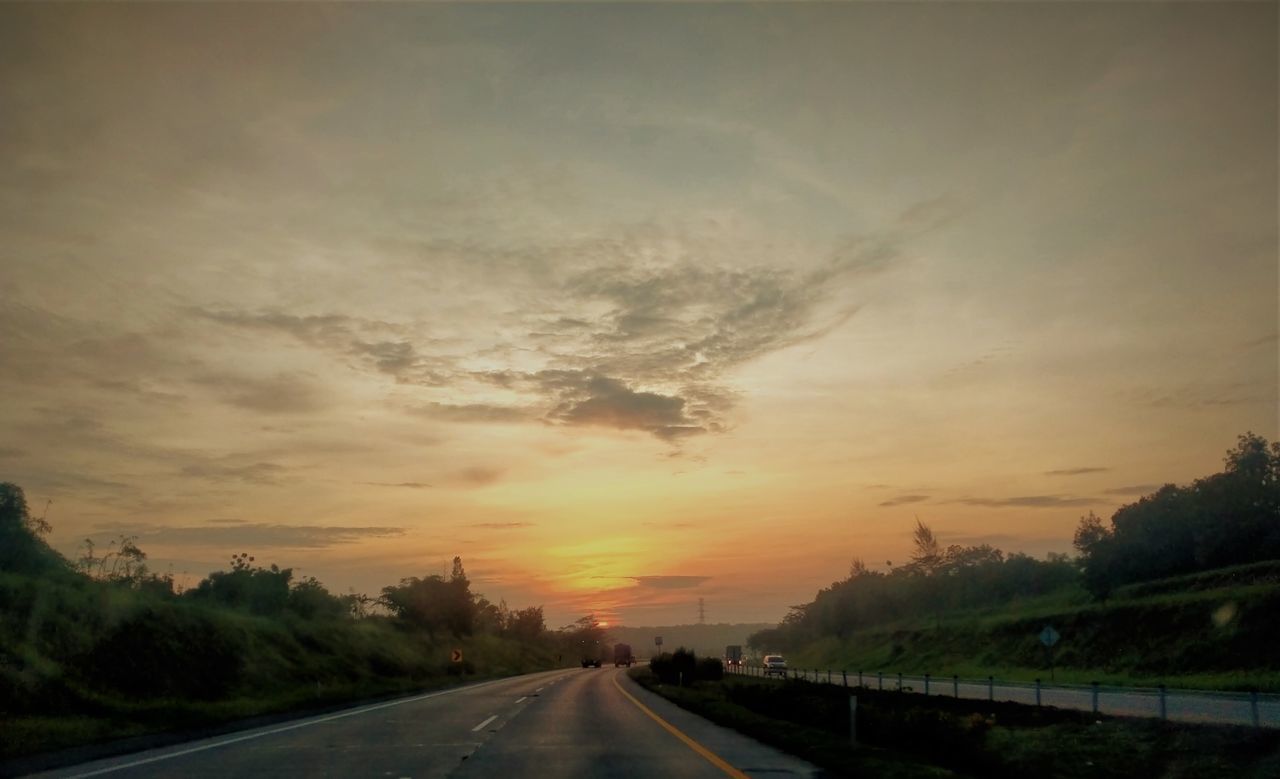 ROAD AGAINST SKY AT SUNSET