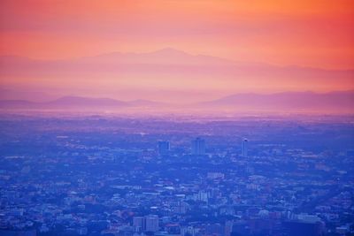 High angle view of buildings against sky during sunset