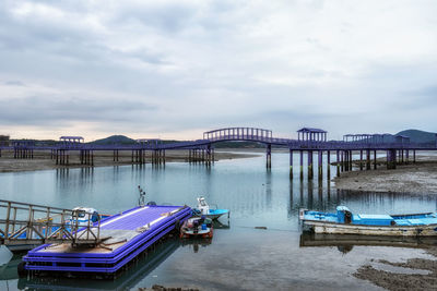 Boats moored at harbor