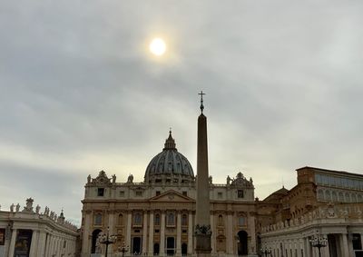 Low angle view of vatican building and sixtine chapel against sky