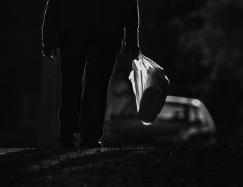 Low section of woman walking outdoors