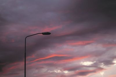 Low angle view of street light against sky during sunset