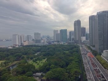 Skyscrapers against cloudy sky