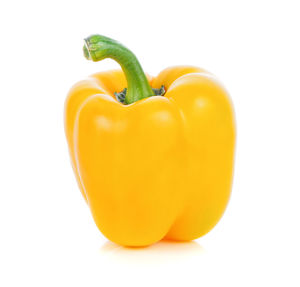Close-up of yellow bell pepper against white background
