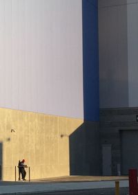 Full length of man standing on railing