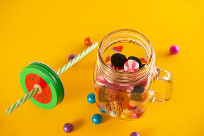 High angle view of multi colored jar on table