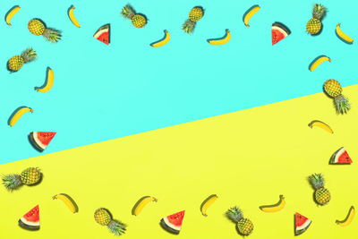 Close-up of fruits over colored background