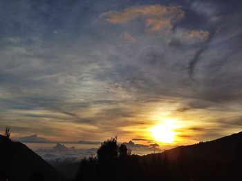 Scenic view of landscape against sky during sunset