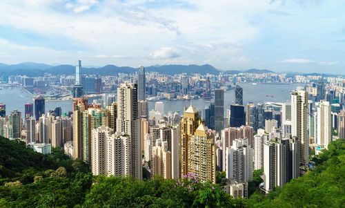 Panoramic view of city and buildings against sky