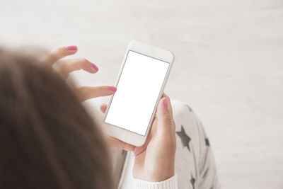 Midsection of woman using mobile phone