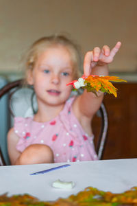 Cute girl sitting at home
