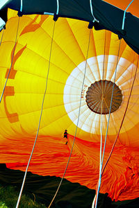 Low angle view of hot air balloon flying against sky