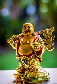 Close-up of buddha statue at temple