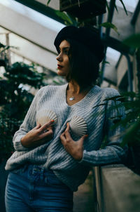 Close-up of young woman standing outdoors