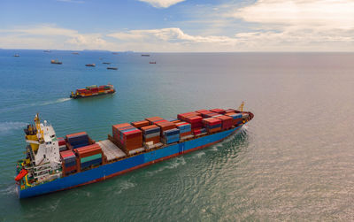 Boats in sea against sky