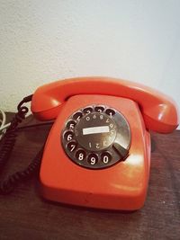 Close-up of telephone booth on table