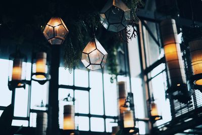 Low angle view of illuminated pendant lights