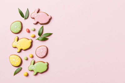 Directly above shot of pills against pink background