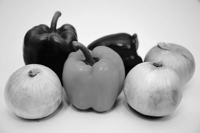 Close-up of fruits on table against white background