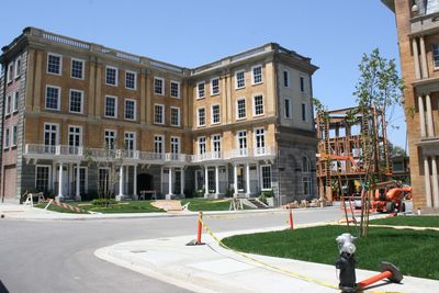 Man playing in front of buildings