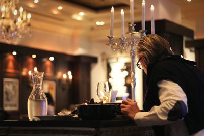 Midsection of woman working in restaurant