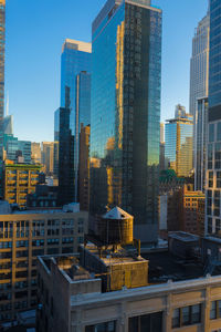 Modern buildings in city against clear sky