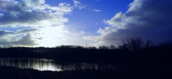 Scenic view of lake against sky during sunset