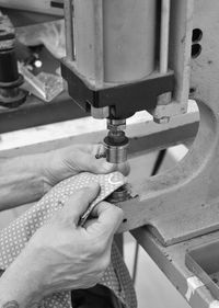 High angle view of person working on metal