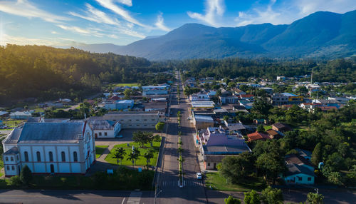 Panoramic view of buildings and mountains against sky