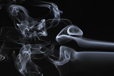 Close-up of smoke against black background