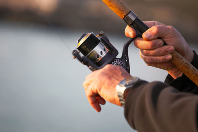 Close-up of man working on camera