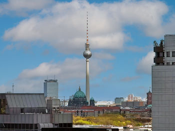 Buildings in city against sky