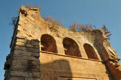 Low angle view of old building against clear sky