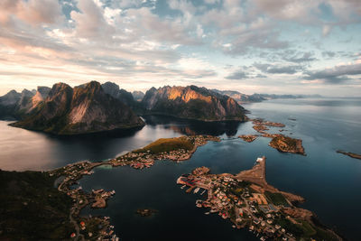 Scenic view of island villages amidst mountains against sky