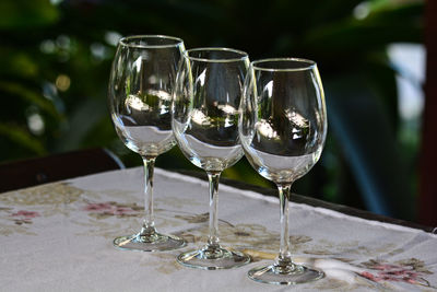 Close-up of wine glasses on table