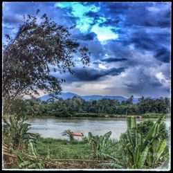 Scenic view of sea against storm clouds