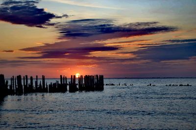 Scenic view of sea against sky during sunset